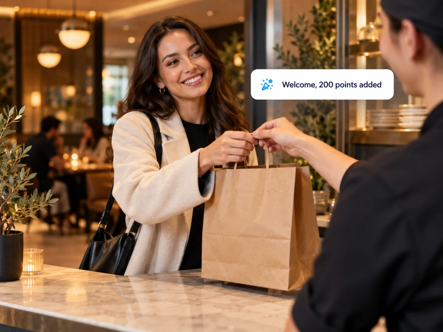 A guest picking up a takeout order and joining the rewards program with a welcome bonus