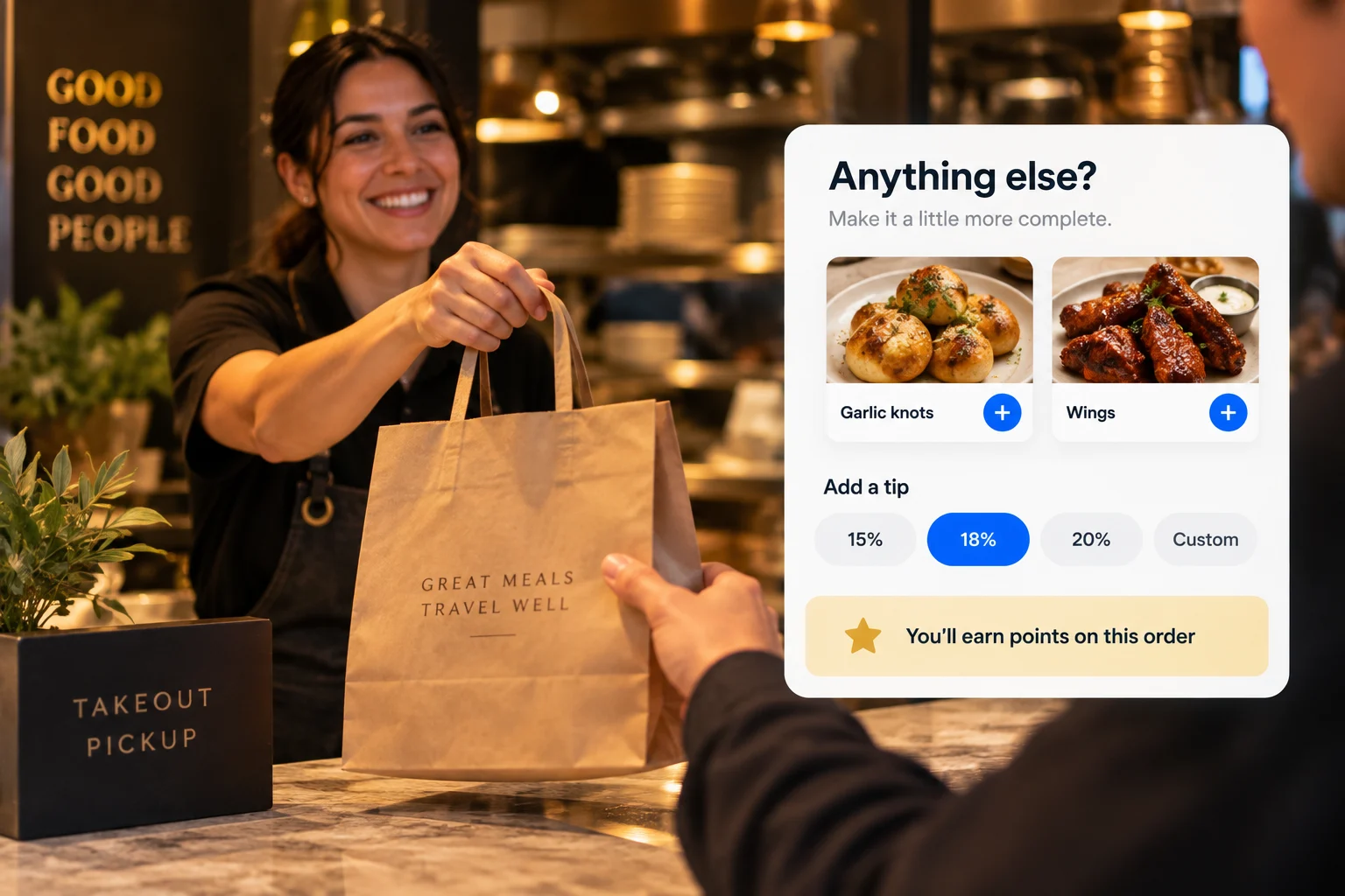 A takeout order handed over at the counter, beside checkout add-ons, tips and loyalty points