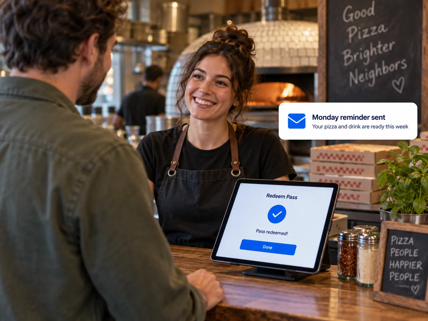 A cashier redeeming a regular’s pass on a counter tablet, with a Monday reminder email sent