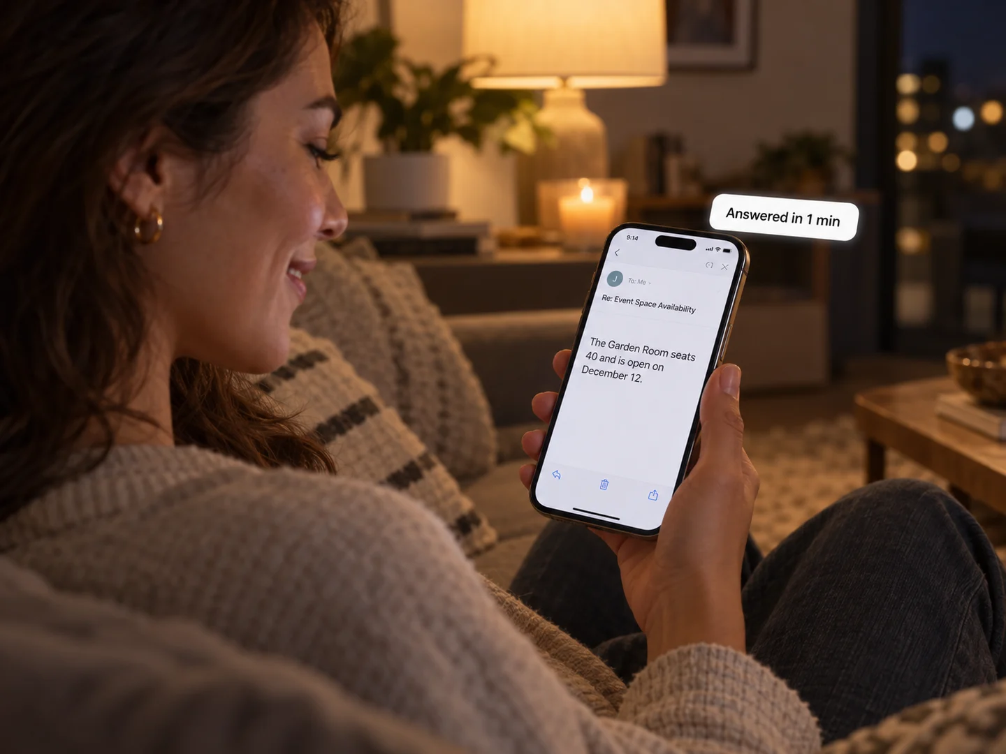 A guest at home reading an emailed reply about the Garden Room, answered in a minute