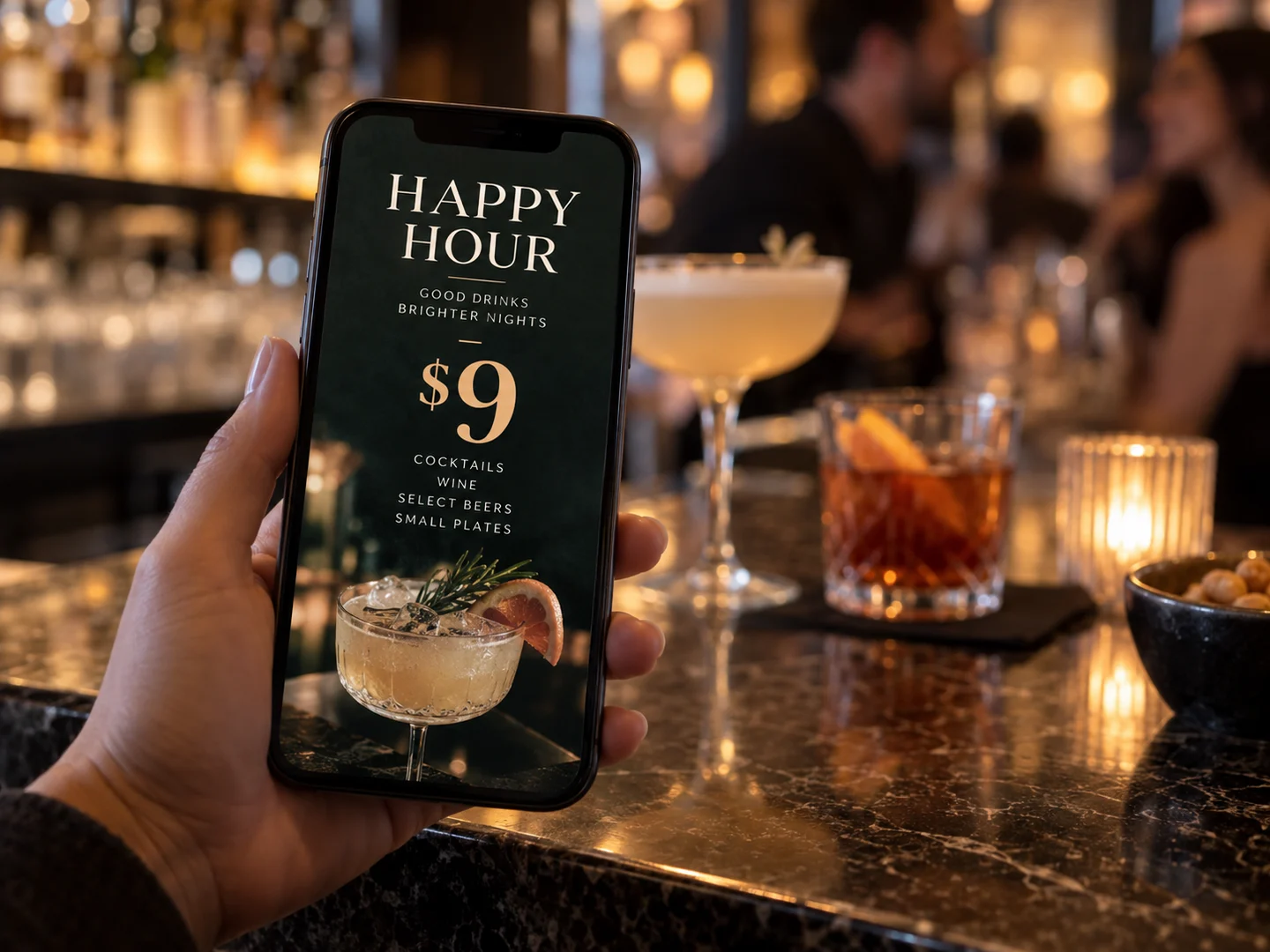 A phone at the bar showing the restaurant’s $9 happy hour board